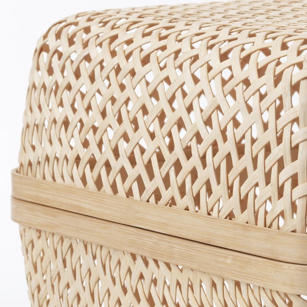Wicker basket woven from dried bamboo, natural beige color, tightly interlaced pattern for durability.