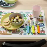 Colorful childrens cutlery and plate on a playful mat. Includes a knife with a serrated edge for easy cutting.