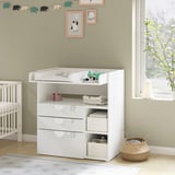 White nursery changing table with drawers, shelves, and baby items. Bright, modern design for baby care.