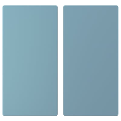 Two identical light blue rectangular panels, smooth and evenly colored, likely part of a childrens storage solution.