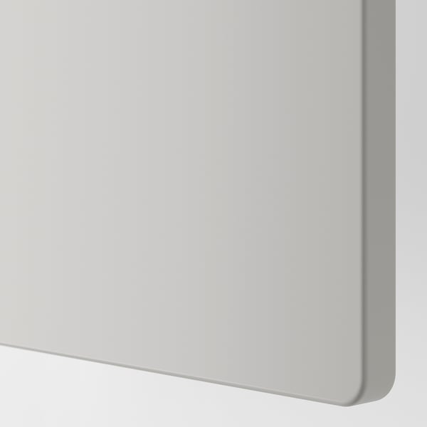 Image depicts the edge of a white, modern piece of furniture with smooth, rounded corners. The surface appears sleek and well-finished.