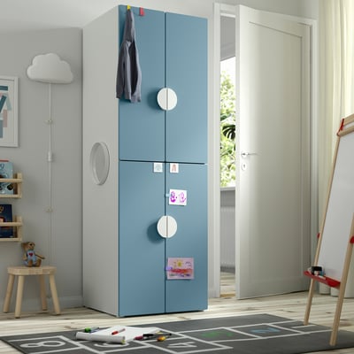 Blue SMÅSTAD kids wardrobe with 2 doors near white door & toys
