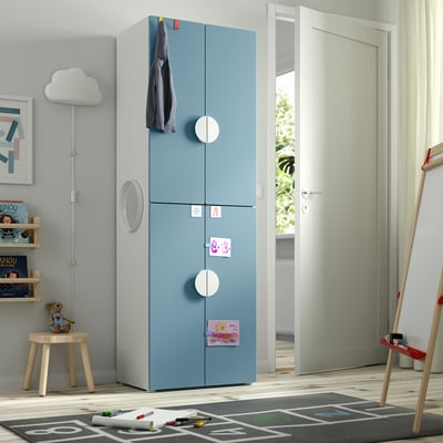 Blue wardrobe with round doors in kids room, gray, minimalist.