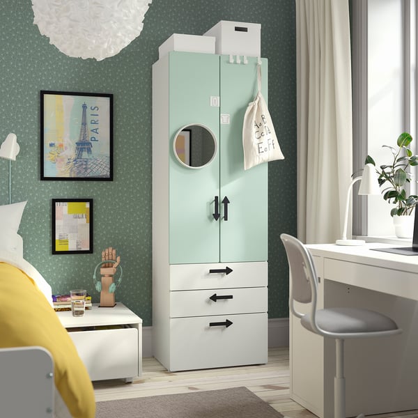 Kids wardrobe: green & white, soft-close doors, round edges. Next to desk & chair, space-saving.