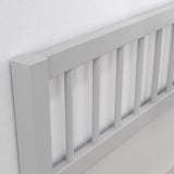 White wooden crib rail with smooth finish