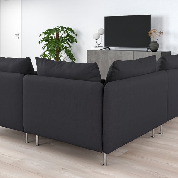 Modern living room with l-shaped SÖDERHAMN sofa in black fabric, tv, and plant. Comfortable and minimalist.