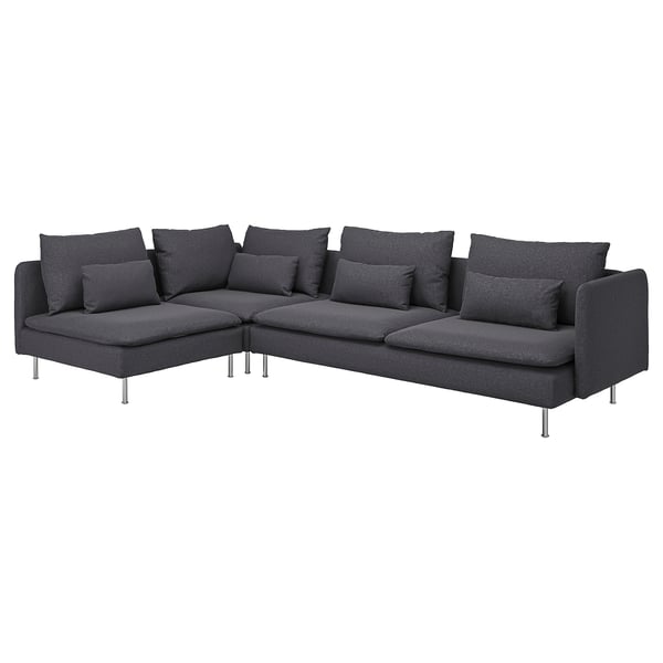 Modern black l-shaped sectional sofa with metal legs, deep cushions, and nine decorative pillows.