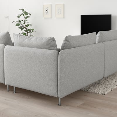 SÖDERHAMN white grey sofa, modern low profile, spacious cushions, sleek metal legs, large tv, plant, minimalist art, cozy rug, bright airy room.