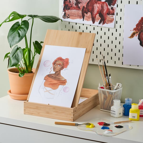 SOLFÅGEL art easel, bamboo & acrylic, displays artwork, holds supplies, portable & stylish, setup with paints & brushes.