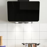 Modern kitchen hood with led light, mounted above a countertop, extracting heat and fumes efficiently.