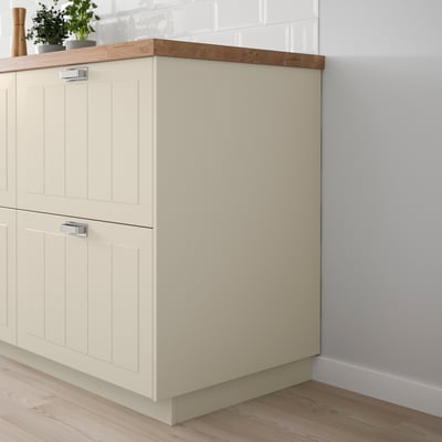A STENSUND off-white kitchen cover panel, made of fibreboard, with a lacquered finish, fitting neatly under cabinets, offering a seamless, clean look.