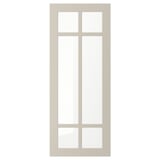 A beige STENSUND glass door with a simple frame and divided glass panel, offering a stylish and warm display.