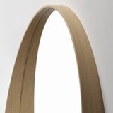 Modern wooden-framed mirror, arched top, light oak finish, reflecting quality craftsmanship.
