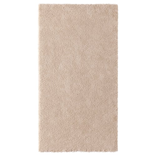 STOENSE beige soft rug, dense pile, rectangular shape, made from synthetic rubber and recycled polyester.
