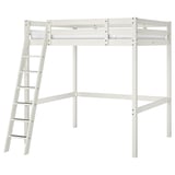 A white wooden STORÅ loft bed with a ladder on one side.