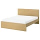 Modern light wood bed with clean lines and no visible fittings.