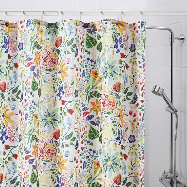 STRANDLUMMER shower curtain: white with vibrant flower patterns, 72x72, polyester, water-repellent. Fits bathroom niches, bright & casual.