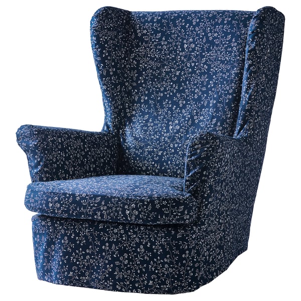 Blue floral-patterned STRANDMON wing chair with high back and armrests, upholstered in polyester and cotton.