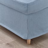 Striped bed skirt on wooden floor; shows quality cotton fabric, neat stitching, and durable wooden feet.