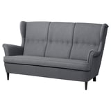 Gray ikea STRANDMON sofa, classic design, high back, dark wooden legs.