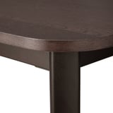 Close-up of a dark wood tabletop with rounded edges supported by black metal legs.