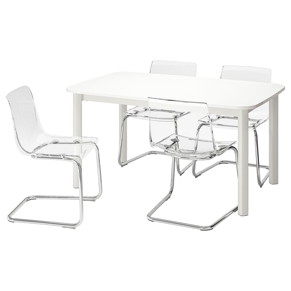 A white STRANDTORP extendable table with four clear plastic chairs, featuring chrome frames. The table and chairs have modern, sleek designs.