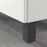 Close-up of STUBBARP leg elevating bestå unit, stabilizing on uneven floors.