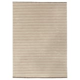 This image shows the TÅGSPÅR rug, a beige and white striped wool rug with a 3d effect.