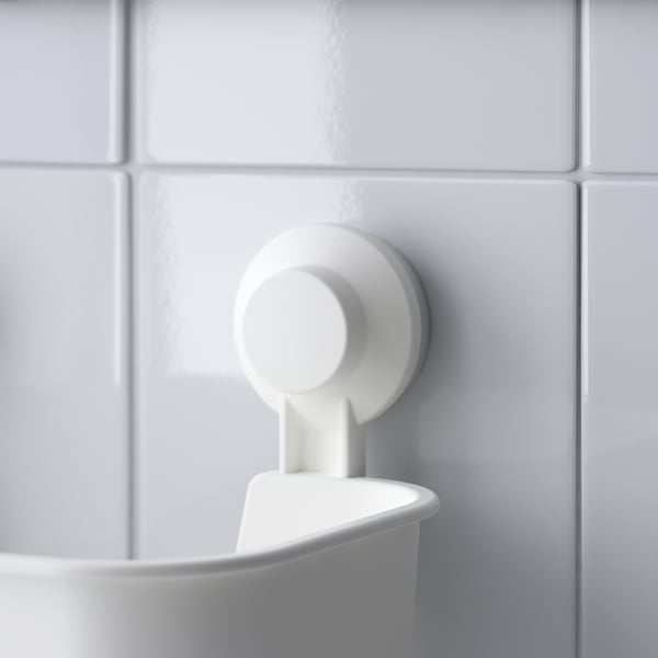 Wall-mounted plastic bowl with suction cup for secure hold on smooth tiles.