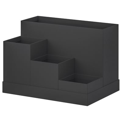 A black TJENA desk organizer with multiple compartments for storage. Its made of recycled paper and has a modern, minimalist design.