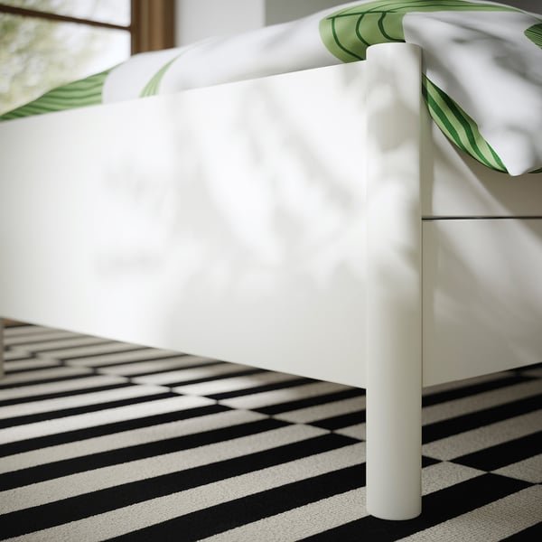 Off-white metal bed frame with smooth lines, soft-close drawers, and adjustable bed sides for comfort and storage.