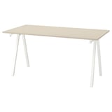 A TROTTEN desk in light beige with white metal legs, rectangular shape, modern design.