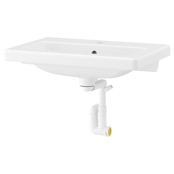 Depicts a TVÄLLEN white ceramic wall-mounted washbasin with a sleek rectangular design and soft edges.
