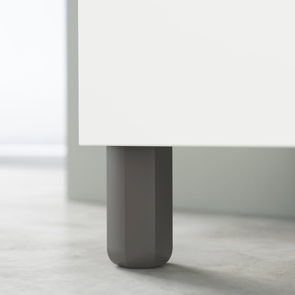 Modern table leg, dark grey, cylindrical shape. Part of ikeas ULLARP design.