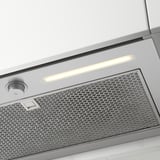 Stainless steel range hood with filter and light.