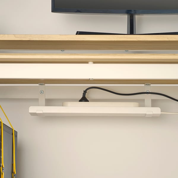 Wall-mounted gaming desk with adjustable height, cable management, and monitor stand.