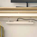 Wall-mounted gaming desk with adjustable height, cable management, and monitor stand.