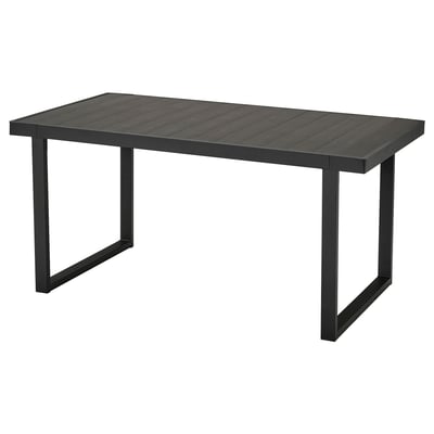 Rectangular VÄRMANSÖ outdoor table with black aluminum top and legs.