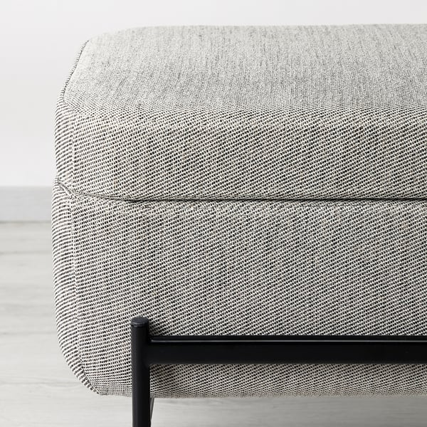 Modern, rectangular upholstered bench with black metal legs and storage space. Soft, patterned fabric top, quality appearance.