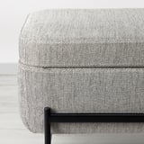 Modern, rectangular upholstered bench with black metal legs and storage space. Soft, patterned fabric top, quality appearance.