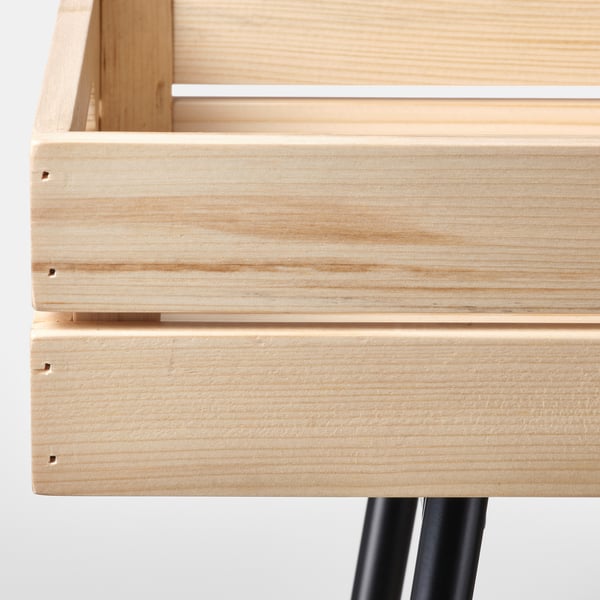 Wooden plant stand close-up, showcasing light wood finish and sturdy construction.