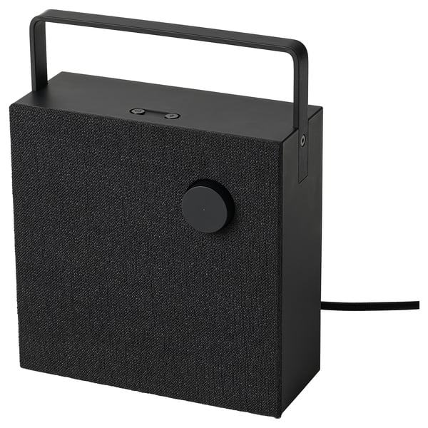 Black VAPPEBY bluetooth speaker with fabric cover, round button, handle, and cord.
