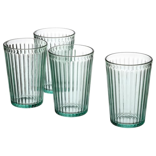 Four clear green-tinted, fluted glass cups with large bases and narrow rims, arranged in a line. Made of tempered glass.