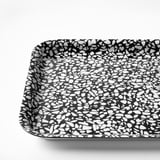 Black and white speckled tray with rounded edges. High-quality design for easy handling and stylish serving.