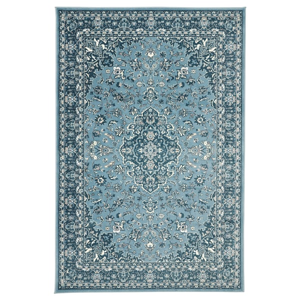 Blue rectangular rug with floral design