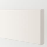 Close-up of VEDDINGE kitchen cabinet in pristine white, showing smooth, clean lines and flawless finish.