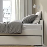 Bed frame with trundle, clean design, includes slatted bed base.