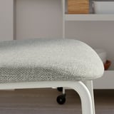 Modern white chair with cushioned seat and back, ideal for comfort and style.