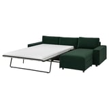 Emerald VIMLE sofa-bed, modern design, green with metal legs.