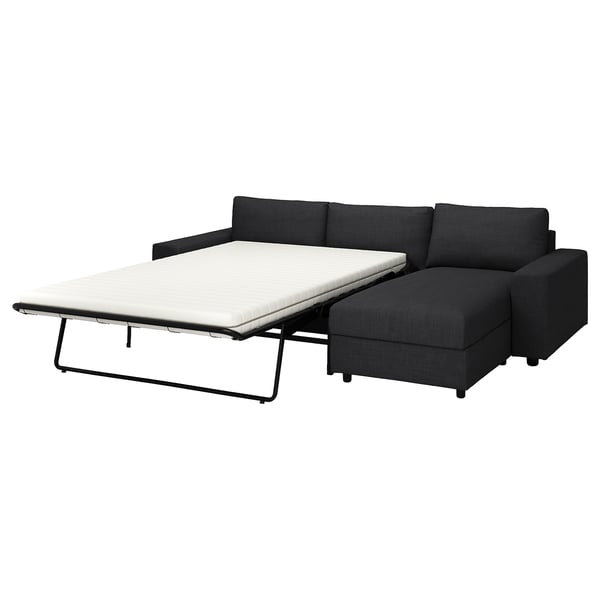 Black corner sofa bed, contemporary design, with extendable chaise longue.
